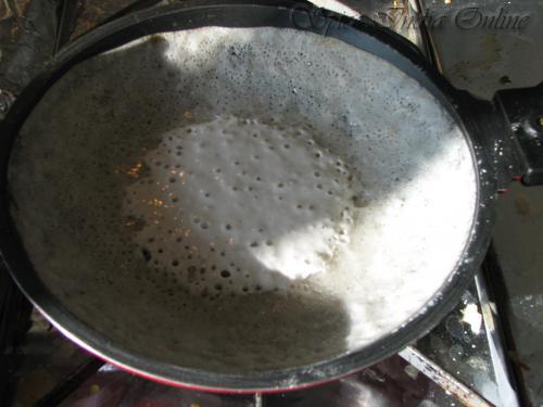 appam: Heat a small non-stick pan which is shallow. Now add a pinch of baking soda.In a spoon take the batter and pour the batter gently to the non-stick pan. Gently swirl the pan around so that a thin layer of batter covers the sides and thick layer collects at the bottom. Cover the lid and cook for 1 to 2 minute till the edges become golden crisp and centre is soft. It is only required to cook on one side of the appam.